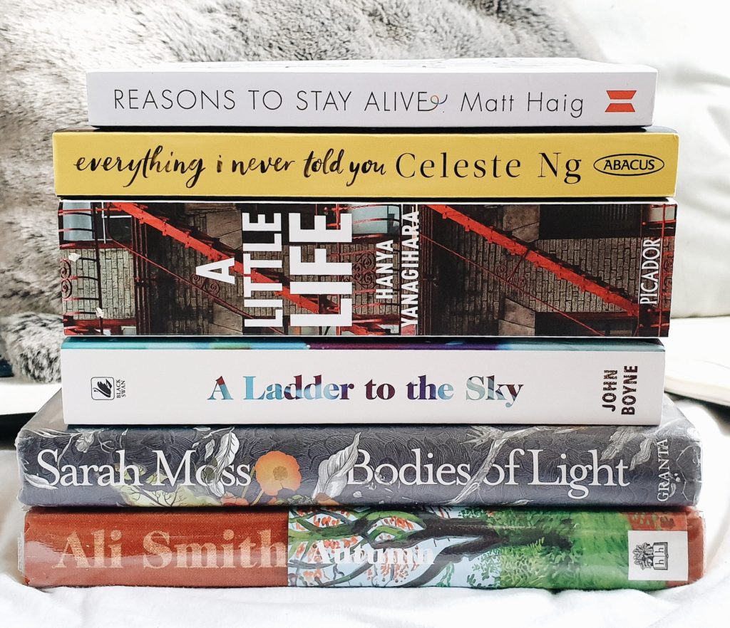 a pile of books to read during summer